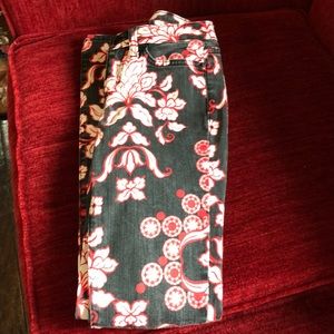 Bebe red and black and white skinny jeans.